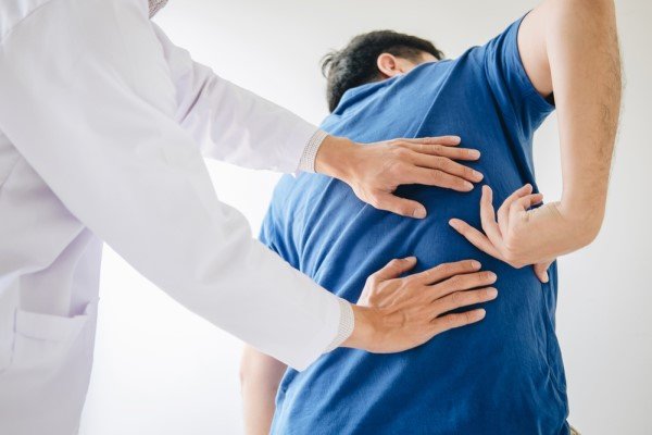 Chiropractor helping a patient recover after trauma