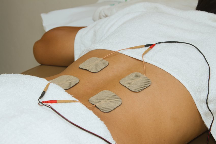 Chiropractic electric muscle stimulation therapy used to relax tight muscles and support recovery